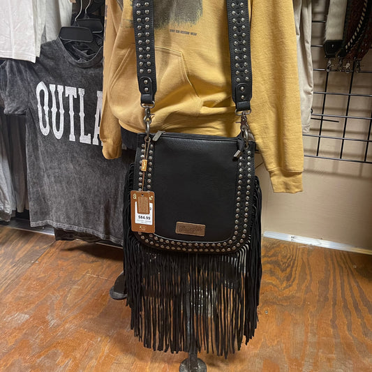 Black crossbody bag with a double row of silver rivets and black fringe 