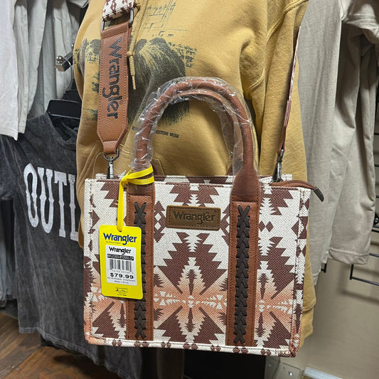 Crossbody/Tote with cream and orange ombre background and brown aztec pattern overlay. Can be used with handles or with removable crossbody strap