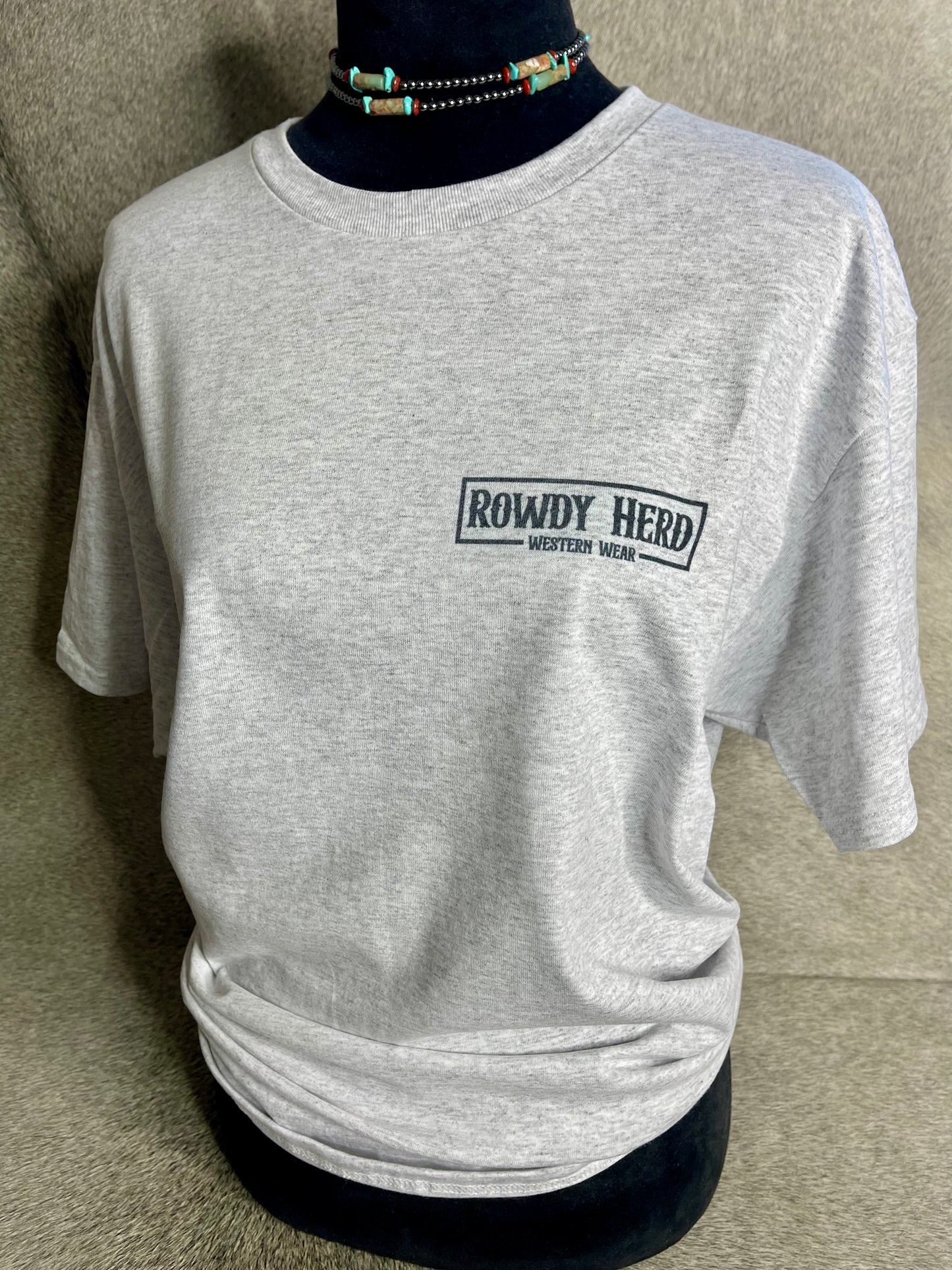 This heather grey Jerzees unisex t-shirt displays the Rowdy Herd logo on the front pocket area.